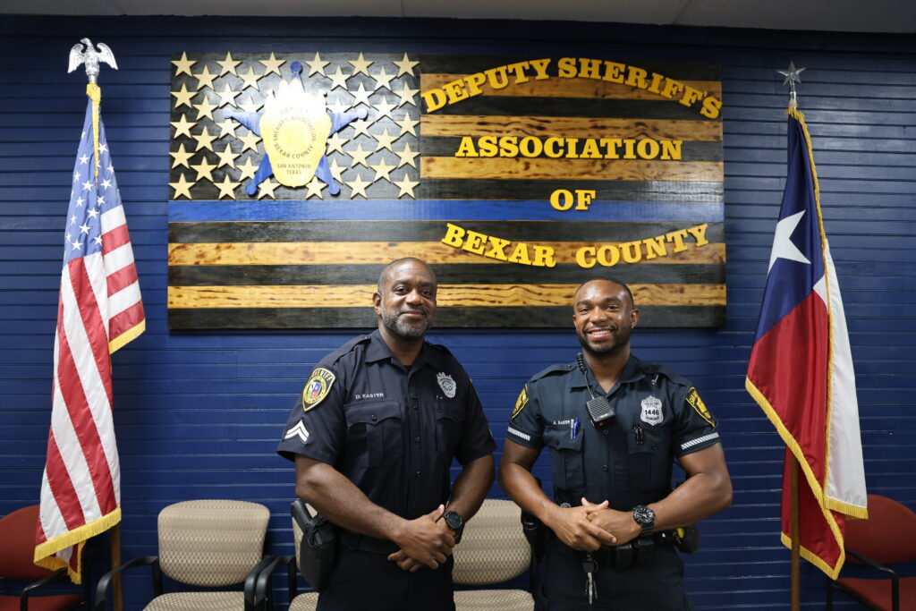 Two men standing in police uniforms