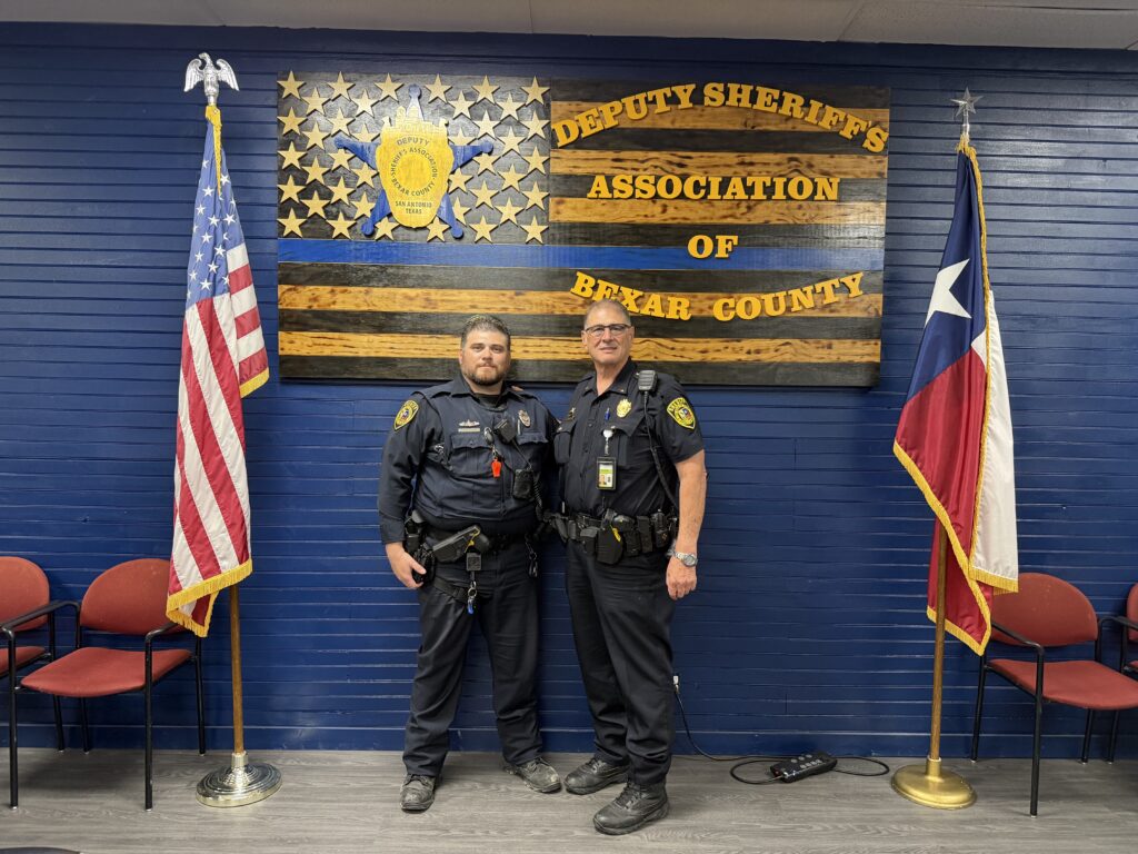Two men in deputy sheriffs' uniforms